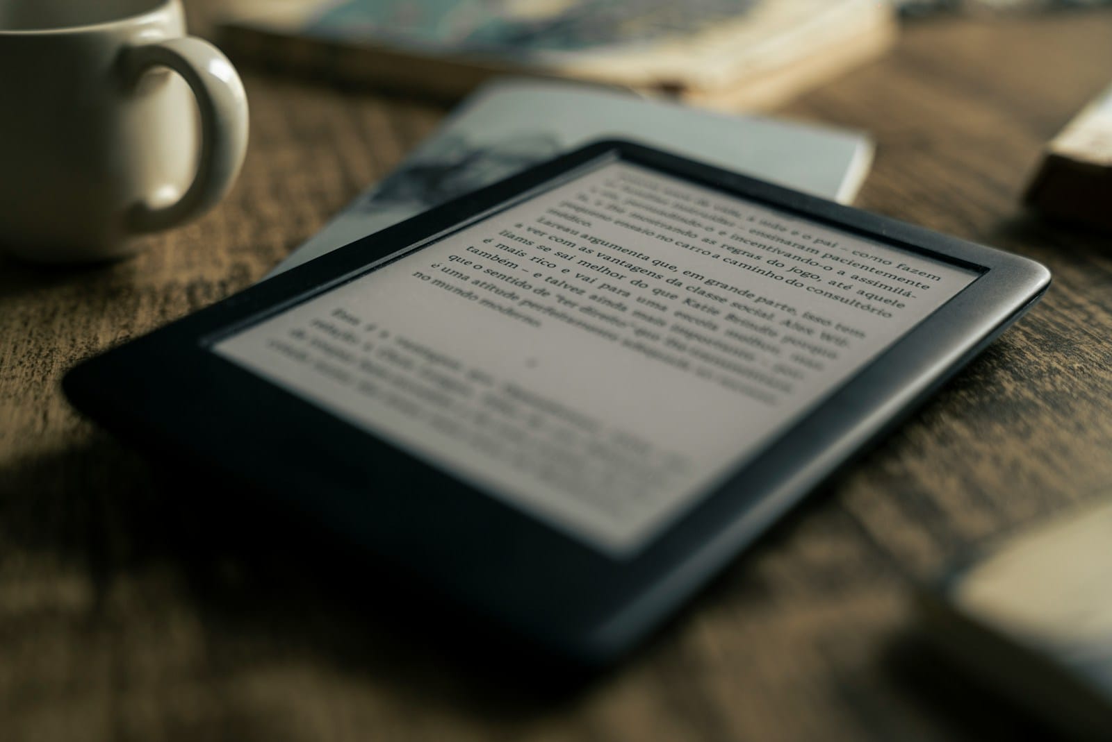 Photo by @felipepelaquim black tablet computer on brown wooden table Right Size for E-Books